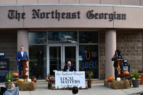 Baldwin mayoral candidates Tom Whitney (left) and Stephanie Almagno (right) listen to  questions from The Northeast Georgian editor Matthew Osborne during Tuesday’s debate. JULIANNE AKERS/Staff