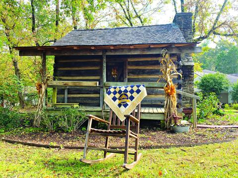 The Historic Mauldin House is shown with a one-of-a-kind Clarkesville  Bicentennial quilt which will be auctioned at the event this weekend. FILE