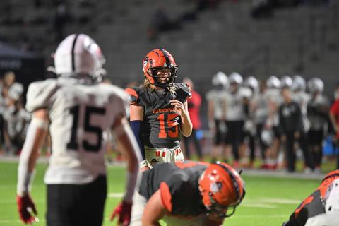 Habersham Central quarterback DJ Pass looks over the defense just before the snap during the Raiders’ win over Jackson County. TOM ASKEW/Special