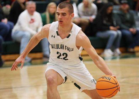 Zakhar Valasiuk dribbles down the court. FILE