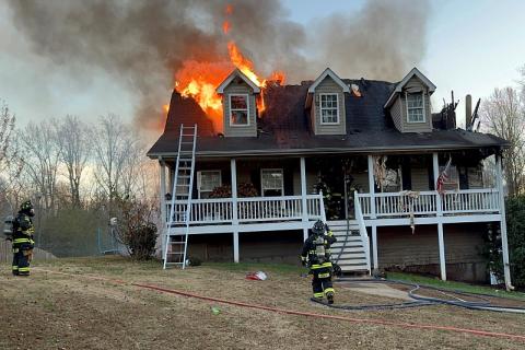 Firefighters work to contain a blaze at a Baldwin home Monday. HABERSHAM COUNTY/Submitted