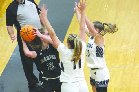 Tallulah Falls’ Millie Holcomb is surrounded by White County defenders on Tuesday night. ELI SHOEMAKE/CNI News Service