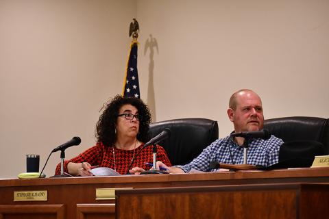 Baldwin Councilmembers Stephanie Almagno (left) and Erik Keith listen to a speaker during Monday’s meeting. JULIANNE AKERS/Staff