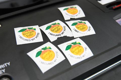 Various election stickers are shown Tuesday waiting for their chance to show off their bearer’s civic pride. ZACH TAYLOR/Special