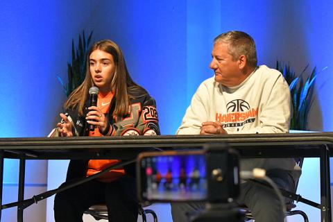 Habersham Central senior Kyia Barrett talks at Wednesday’s FCA Basketball Media Day at Free Chapel in Gainesville alongside Lady Raiders coach Bill Bradley. LANG STOREY/Staff