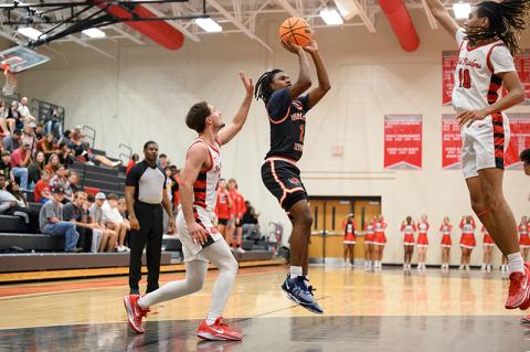 Habersham Central’s Enzo Combs floats over two Madison County defenders for two points. ZACH TAYLOR/Special