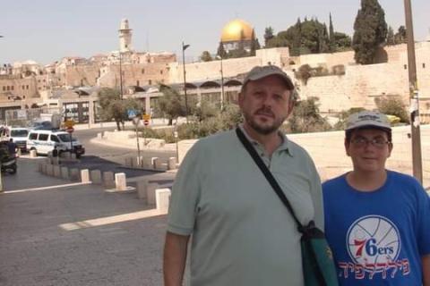 Joshua Peck, left, and his son Ari tour in Jerusalem in 2011. The Temple Mount, regarded as a holy site in Christianity, Islam and Judaism, stands behind them. SUBMITTED