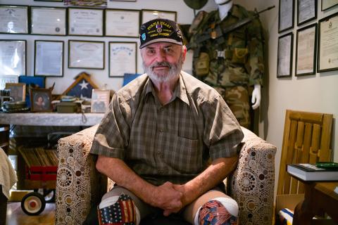 zVietnam veteran and Purple Heart recipient Ray H. Bowen sits in the military memorabilia room in the house of friend and fellow Vietnam veteran Charlie Mack Booth. ZACH TAYLOR/Special