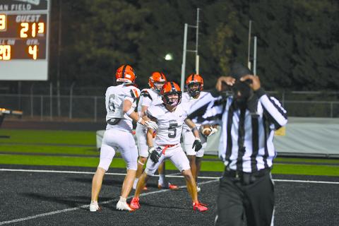 Habersham Central’s Zeke Whittington and Jonah WIlson help celebrate Donnie Warren’s touchdown on Friday night as the Raiders topped Shiloh. TOM ASKEW/Special