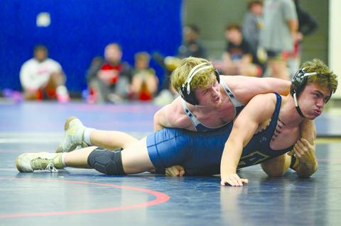 Habersham Central’s Justin Whitney defeats Apalachee’s William Harp by pinfall in the 165-pound weight class during the 2023 Raider invitational. ZACH TAYLOR/Special