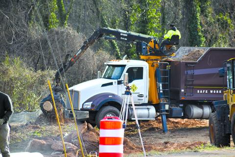 Workers undertake moving the sewer lines near the Johnny Mize Bridge in Demorest. MATTHEW OSBORNE/Staff