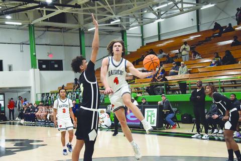 Habersham Central’s Brannon Gaines drives to the hoop last weekend against Greer (S.C.). The Raiders have won seven consecutive games heading into tonight’s game in Cleveland. SHANE SCOGGINS/CNI News Service