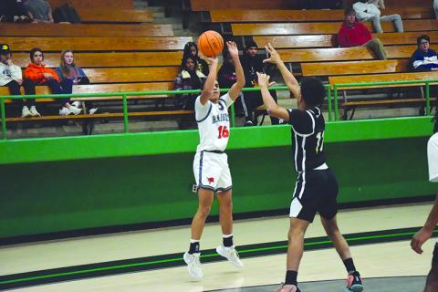 Habersham Central’s Jalen Davis fires a jumper from the corner. SHANE SCOGGINS/CNI News Service