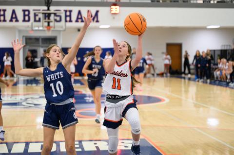Kylie Littlejohn goes up for a layup while being heavily guarded. ZACH TAYLOR/Special