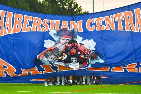 Habersham Central’s football team is led out by Andru Kinnarath. LANG STOREY/Staff