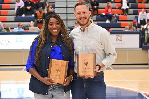 New Raider Basketball Hall of Fame inductees Sheena Trimiar and Heath Barrett meet on the court between games Friday night. TOM ASKEW/Special