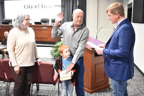 Demorest Councilman Jimmy Davis is sworn in Tuesday by Mayor Jerry Harkness for his first term on the council along with his wife Patti and great grandson Carter Willis. MATTHEW OSBORNE/Staff