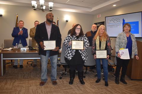 Habersham County Senior Center care provider Joshua Haynie and employees Sonya Turgeon and Laureen Pemberton were honored Tuesday night by Senior Center Director Kathy Holcomb (right) and the Board of Commissioners for their recent heroism in three crises. MATTHEW OSBORNE/Staff