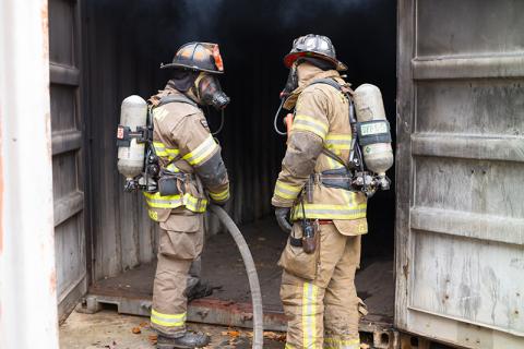 Cameron Lucas and Payton Cagle discuss maneuvers around the burning training building in November. ZACH TAYLOR/Special
