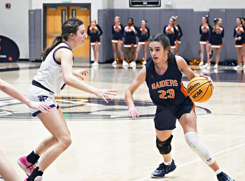 Habersham Central's Kyia Barrett (right) looks to drive past a North Forsyth defender on Friday night. LANG STOREY/Staff