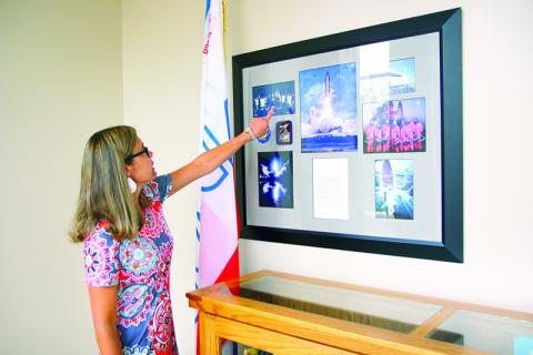 Tallulah Falls School Upper School Academic Dean Kim Popham observes the many keepsakes reminiscing when students and faculty won the opportunity to travel to the White House. FILE