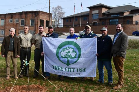 Shown (from left) at Cornelia’s Arbor Day celebration are Commissioner Don Bagwell, Michael Wood, Clay Pardue, Chris Norton, Commissioner Mark Reed, Jonathan Goss, Kevin Clark and Mayor John Borrow. JULIANNE AKERS/Staff