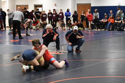 Habersham Central coaches Morris Brooks and Len King instruct McKenzie Spradley at the state sectional meet Friday. LANG STOREY/Staff