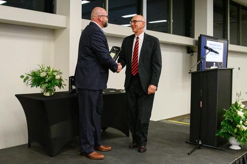 Jeremy Spradlin (left) shakes hands with Habersham County Hall of Fame Inductee Rope Roberts at the Chamber of Commerce Gala on Feb. 8. ZACH TAYLOR/Special