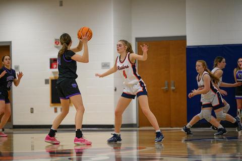 Lady Raiders senior Sophie Bramlett gets set on defense against North Forsyth on Friday night. More Senior Night pics, pages 4-5B. ZACH TAYLOR/Special