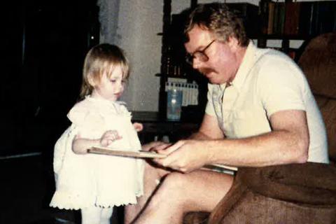 Pops reads with Kenz way back in the day.
