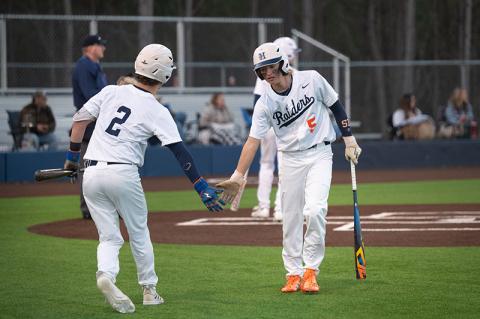 After touching home plate, Maverick Chitwood low-fives Raiders catcher Spencer Frady on the way to the dugout in an earlier win over Elbert County. ZACH TAYLOR/Special