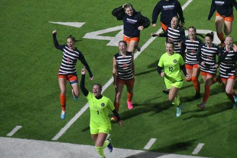 Habersham Central’s girls soccer team runs to the stands to acknowledge the crowd that sat through 100 minutes of rain and wind to watch them earn a program-altering 2-1 win over Jackson County on Friday. Scan above for Tuesday’s match results. MATTHEW OSBORNE/Staff 