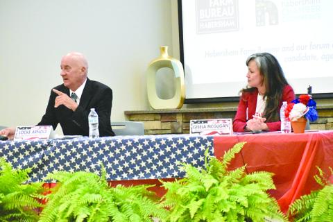 District 5 challengers Locke Arnold (left) and Gisela McGugan participate in the Farm Bureau political forum on Tuesday night.
