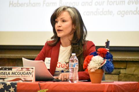Gisela McGugan speaks at the Farm Bureau political forum.