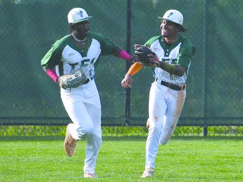 Tallulah Falls’ Danny Grant and BJ Carver dap each other up after an inning-ending catch by the former.