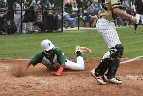 TFS' Danny Grant slides in for a run during Saturday's state quarterfinal win. LANG STOREY/Staff