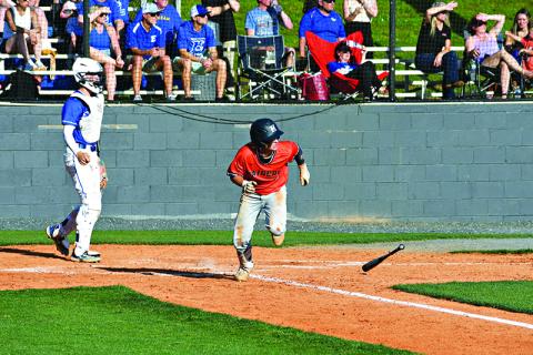 Maverick Chitwood busts it out of the batters box after grounding into a fielder’s choice  during Wednesday’s playoff game at Etowah. LANG STOREY/Staff