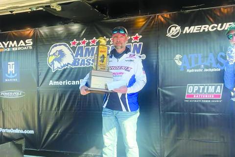 Brad Benfield holds his trophy after winning the 2024 American Bass Anglers (ABA) Ray Scott Championship title. SUBMITTED