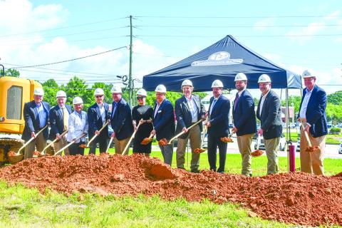 Rabun County Bank executives and local representatives gathered at a groundbreaking for the Clarkesville branch of Traditions Bank. Shown are (from left) Jerry Krivsky, Bob Tritt, Wanda Hutchison, Greg Funkhouser, Claude Dillard, Melanie Silvestri, Sidney Roland, Claude Rickman, Sam Beck, Victor Anderson, Bo Hatchett and Johnny Irvin. JULIANNE AKERS/Staff