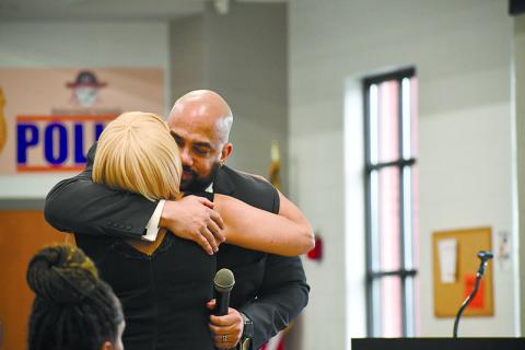 Dr. Aaron Scott and his mother, Sheree Parrish, of Cornelia, embrace at the 2024 Lifetime Achievement Award ceremony. JULIANNE AKERS/Staff