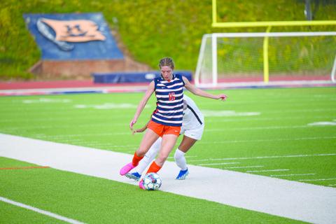 Abigail Hotard flicks the ball upfield to Meg LaBarbera. ZACH TAYLOR/Special
