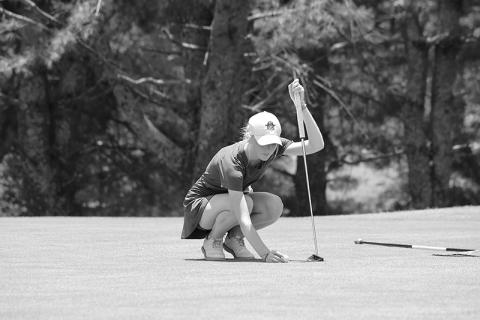 Addie Maney lines up a putt during Round 1 at Apple Mountain. LANG STOREY/Staff