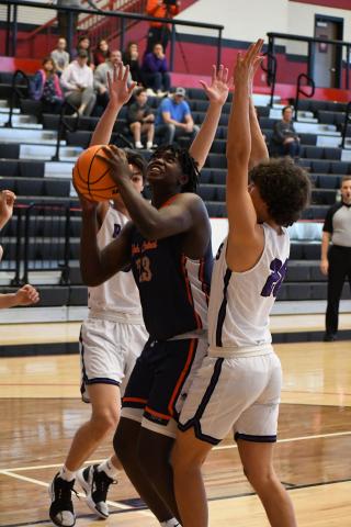 osiah McCurry gets surrounded by defenders during a game last year. He will get plenty of attention from colleges during his senior year. FILE