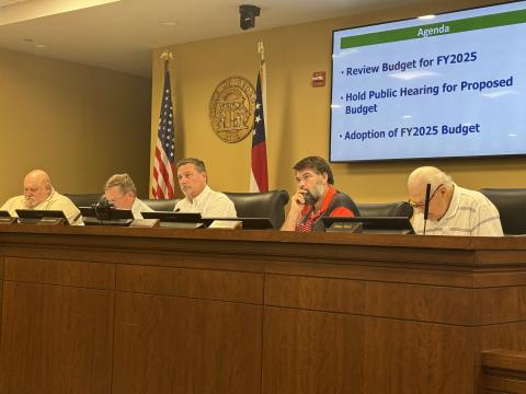 Habersham County Commissioners (from left) Bruce Palmer, Bruce Harkness, Ty Akins, Dustin Mealor and Jimmy Tench try to find common ground Monday night.