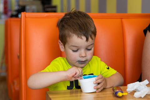 Tommy Howard enjoys his Cookie Monster ice cream at Scoops in Clarkesville. ZACH TAYLOR/Special