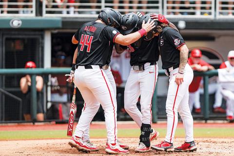 Georgia’s Slate Alford, Tre Phelps and Paul Toetz celebrate during Sunday’s Game 2 win. KARI HODGES/UGAAA