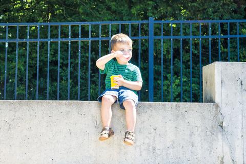 Callan Smith enjoys a snow cone at the Baldwin Mayor’s Reading Club Summer Kickoff on June 7.  Photos by JULIANNE AKERS/Staff