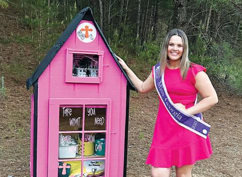 Ansleigh Sherlin stands next to her newly installed blessing box at Little Dreamers Academy in Cornelia. 