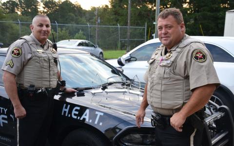In 2021, former HEAT unit deputy Kris Hall and Deputy Brandon Holcomb show off the Habersham County Sheriff’s Office’s haul of awards from the Golden Shield Honors. MATTHEW OSBORNE/Staff