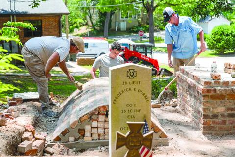 From left: Alton Fry, Danny McDuffie and Mason Tench with Fry Masonry work on restoring the  Durbec family plot at Old Clarkesville Cemetery. JULIANNE AKERS/Staff